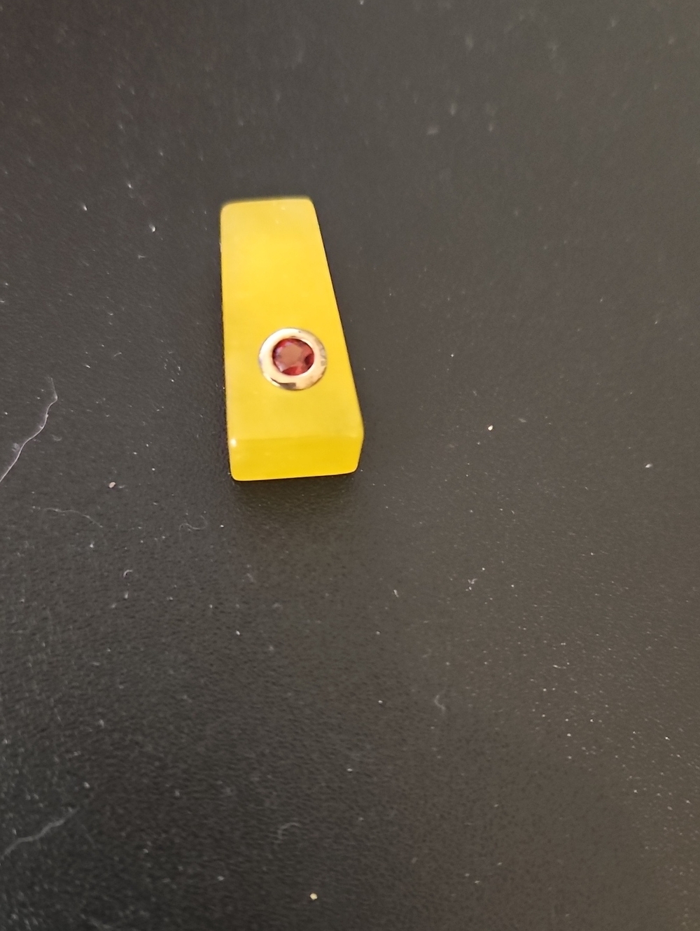Yellow Pendant with Red Gem Accent